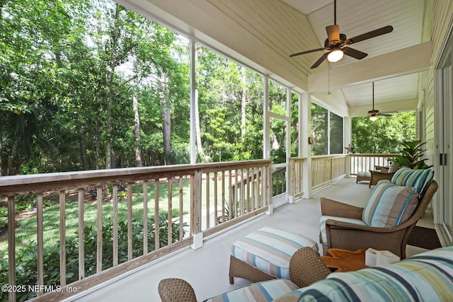 sunroom with a ceiling fan and outdoor lounge area