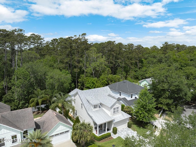 aerial view featuring a wooded view