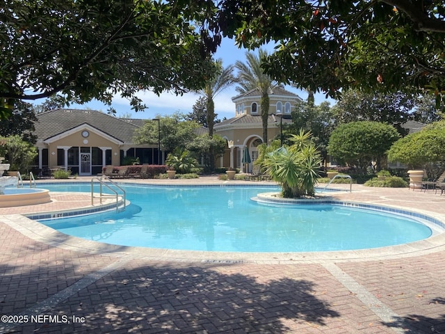 community pool featuring a patio area