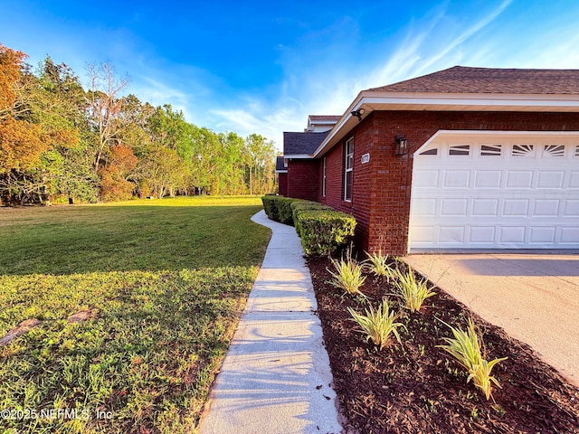 view of property exterior featuring brick siding, roof with shingles, and a yard