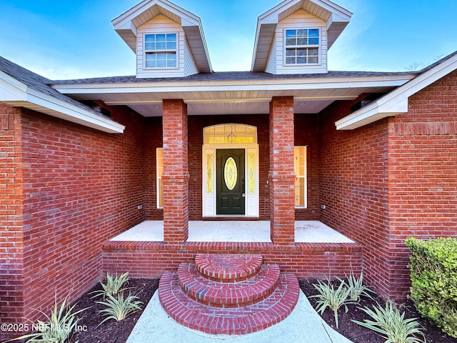 entrance to property with brick siding