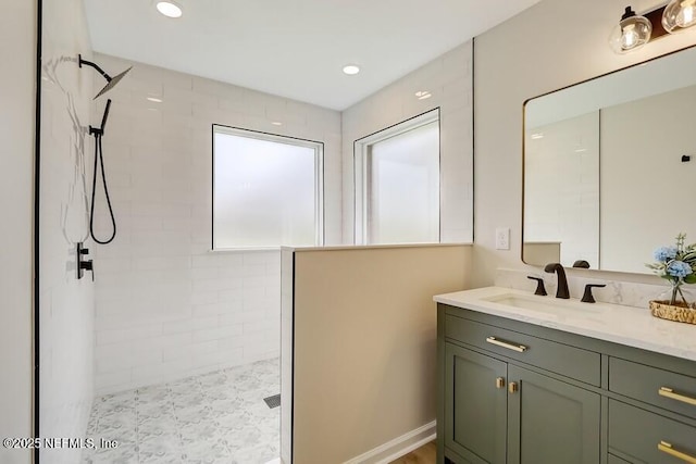 full bathroom with recessed lighting, a walk in shower, and vanity