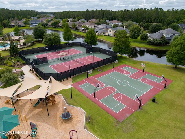 bird's eye view with a residential view and a water view