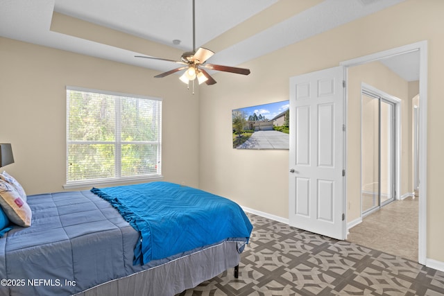 bedroom with baseboards and ceiling fan