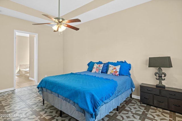bedroom featuring connected bathroom, baseboards, and ceiling fan