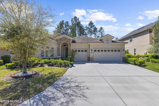 view of front of home featuring stucco siding, stone siding, a garage, and concrete driveway