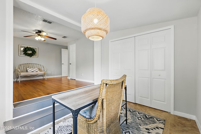 dining space featuring a ceiling fan, baseboards, and visible vents