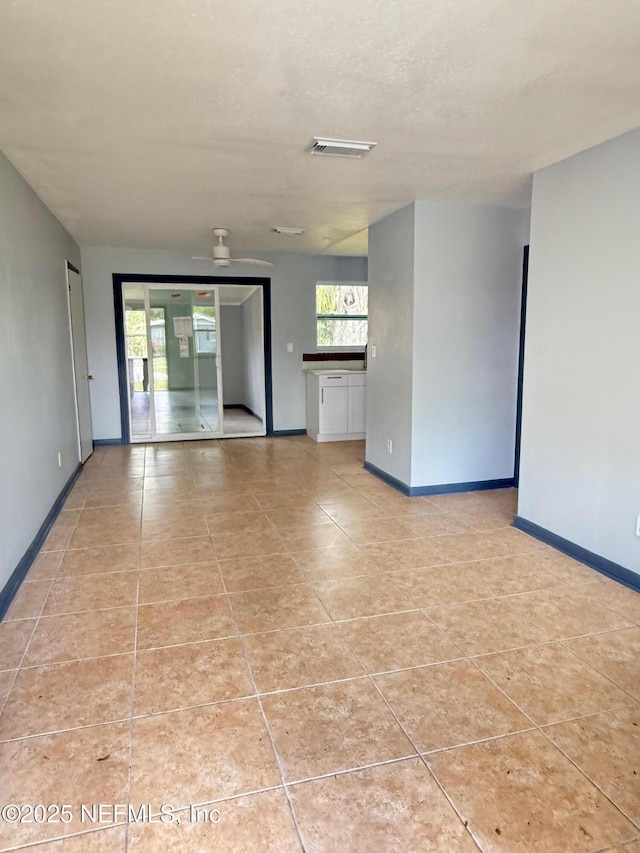 5521 Sabena Rd, Jacksonville, FL 32207 - spare room featuring light tile patterned flooring, visible vents, and baseboards