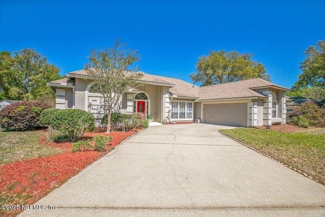 388 Lolly Ln, Saint Johns, FL 32259 - view of front of property featuring stucco siding, driveway, and a garage