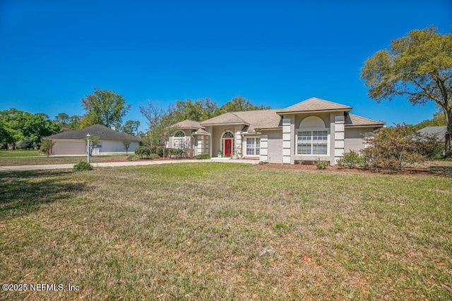 388 Lolly Ln, Saint Johns, FL 32259 - view of front of property featuring a front yard and stucco siding