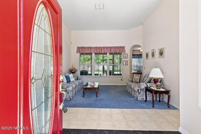 388 Lolly Ln, Saint Johns, FL 32259 - living room with arched walkways, baseboards, carpet flooring, and visible vents