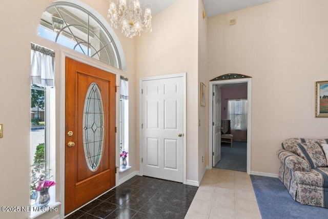388 Lolly Ln, Saint Johns, FL 32259 - entrance foyer featuring baseboards, a high ceiling, and a chandelier