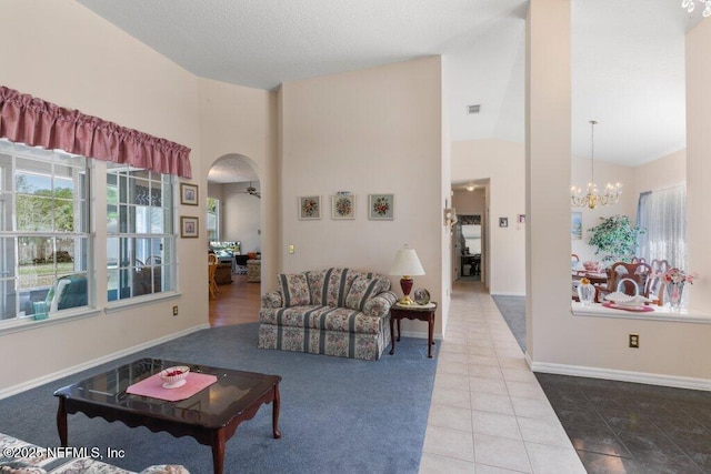 388 Lolly Ln, Saint Johns, FL 32259 - living area featuring tile patterned flooring, baseboards, visible vents, and high vaulted ceiling