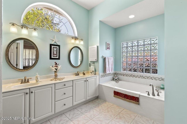 388 Lolly Ln, Saint Johns, FL 32259 - bathroom featuring plenty of natural light, a sink, and a bath