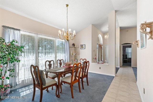 388 Lolly Ln, Saint Johns, FL 32259 - dining space with baseboards, a notable chandelier, tile patterned floors, and lofted ceiling