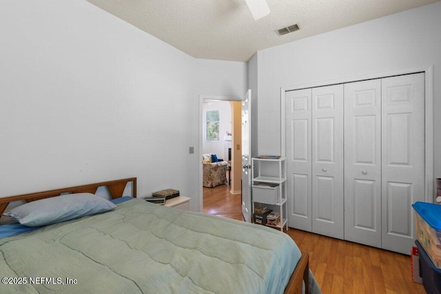 388 Lolly Ln, Saint Johns, FL 32259 - bedroom with a textured ceiling, a ceiling fan, wood finished floors, visible vents, and a closet