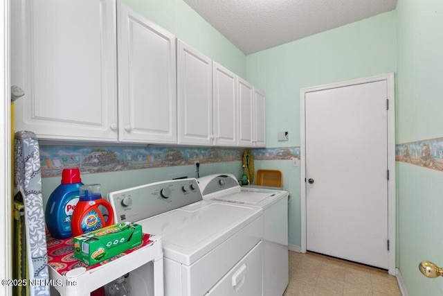 388 Lolly Ln, Saint Johns, FL 32259 - clothes washing area with a textured ceiling, washing machine and dryer, and cabinet space
