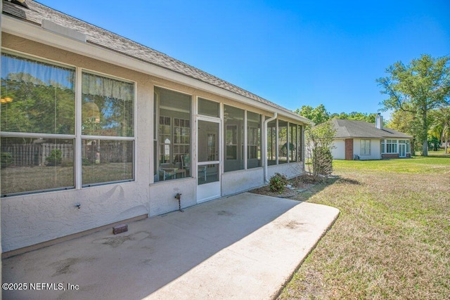 388 Lolly Ln, Saint Johns, FL 32259 - exterior space featuring a lawn, a patio, stucco siding, and a sunroom