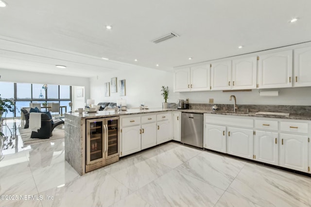 2280 Shepard St Unit 603, Jacksonville, FL 32211 - kitchen with a peninsula, dishwasher, wine cooler, a sink, and open floor plan