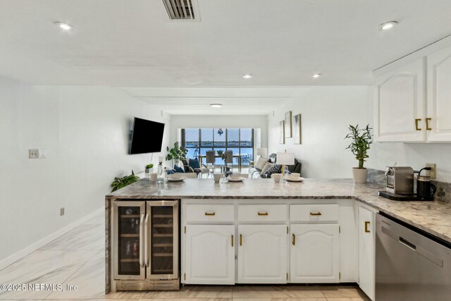 2280 Shepard St Unit 603, Jacksonville, FL 32211 - kitchen with wine cooler, white cabinetry, dishwasher, a peninsula, and visible vents