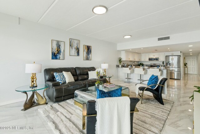 2280 Shepard St Unit 603, Jacksonville, FL 32211 - living room with marble finish floor, baseboards, visible vents, and recessed lighting