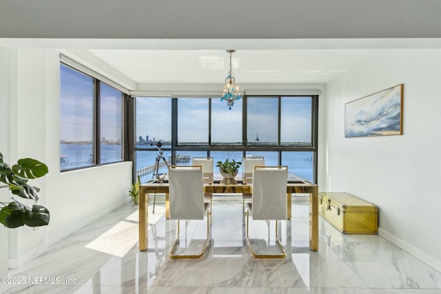 2280 Shepard St Unit 603, Jacksonville, FL 32211 - dining space featuring marble finish floor, a water view, and a healthy amount of sunlight