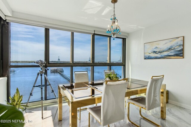 2280 Shepard St Unit 603, Jacksonville, FL 32211 - dining room featuring marble finish floor, a water view, and baseboards