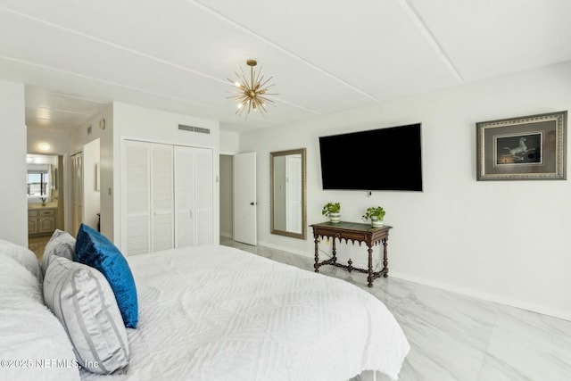 2280 Shepard St Unit 603, Jacksonville, FL 32211 - bedroom featuring a closet, ensuite bathroom, marble finish floor, baseboards, and visible vents