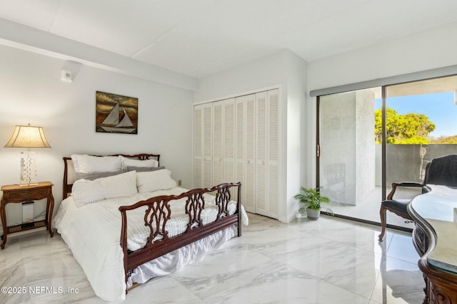 2280 Shepard St Unit 603, Jacksonville, FL 32211 - bedroom with a closet, marble finish floor, and access to exterior