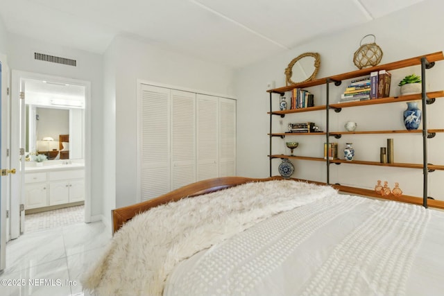 2280 Shepard St Unit 603, Jacksonville, FL 32211 - bedroom featuring baseboards, marble finish floor, connected bathroom, visible vents, and a closet