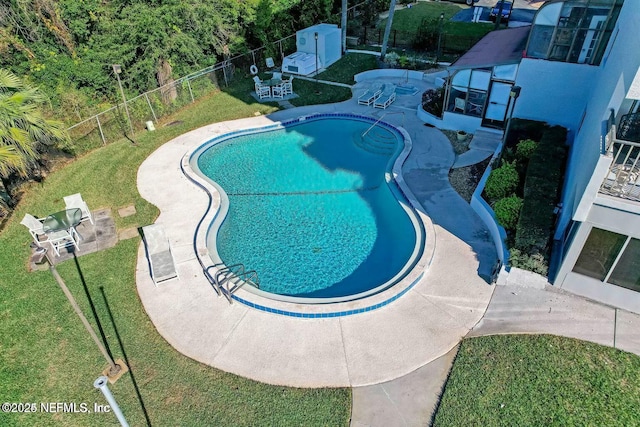 2280 Shepard St Unit 603, Jacksonville, FL 32211 - community pool with a fenced backyard, a yard, and a patio area