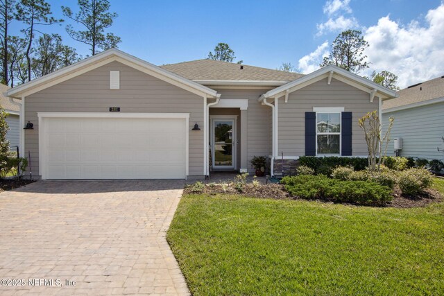 281 Tintamarre Dr, Saint Augustine, FL 32092 - ranch-style home with a front yard, decorative driveway, and a garage