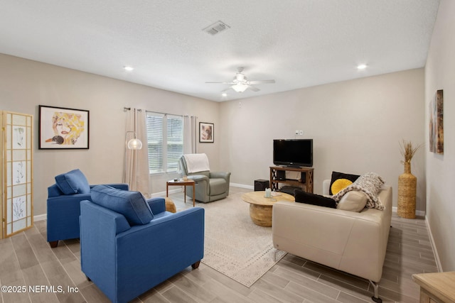 281 Tintamarre Dr, Saint Augustine, FL 32092 - living room featuring wood tiled floor, visible vents, baseboards, and a ceiling fan