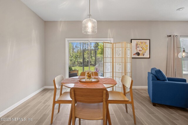 281 Tintamarre Dr, Saint Augustine, FL 32092 - dining area featuring baseboards and wood tiled floor