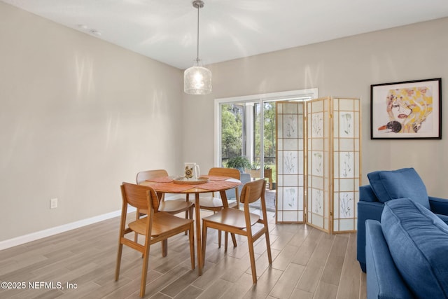281 Tintamarre Dr, Saint Augustine, FL 32092 - dining area featuring baseboards and wood tiled floor
