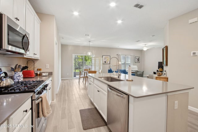 281 Tintamarre Dr, Saint Augustine, FL 32092 - kitchen featuring a sink, visible vents, light wood-style floors, and appliances with stainless steel finishes