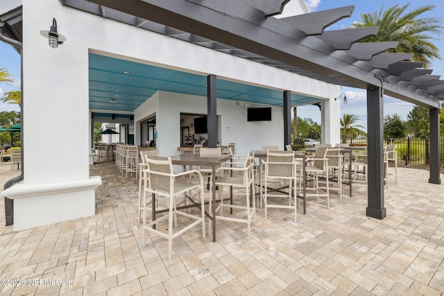 281 Tintamarre Dr, Saint Augustine, FL 32092 - view of patio with a pergola, outdoor dining area, and fence