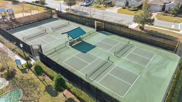 281 Tintamarre Dr, Saint Augustine, FL 32092 - view of tennis court featuring a residential view and fence