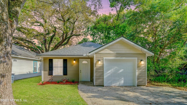 3251 Ernest St, Jacksonville, FL 32205 - ranch-style house featuring a lawn, driveway, a shingled roof, and a garage