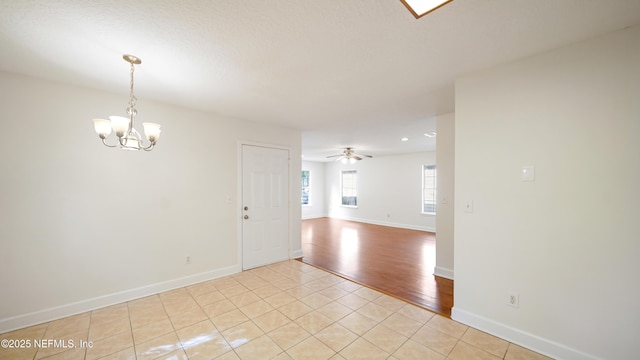 3251 Ernest St, Jacksonville, FL 32205 - spare room with baseboards, a chandelier, and light tile patterned floors