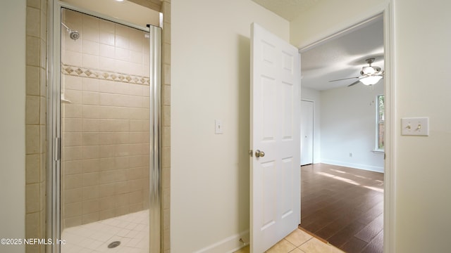 3251 Ernest St, Jacksonville, FL 32205 - full bath with baseboards, a ceiling fan, wood finished floors, and a shower stall