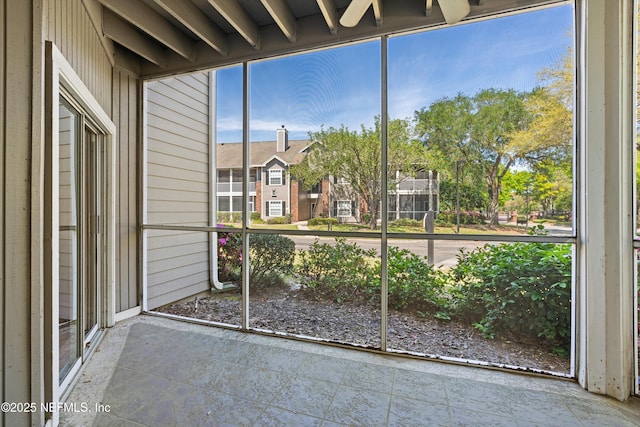 unfurnished sunroom with a residential view