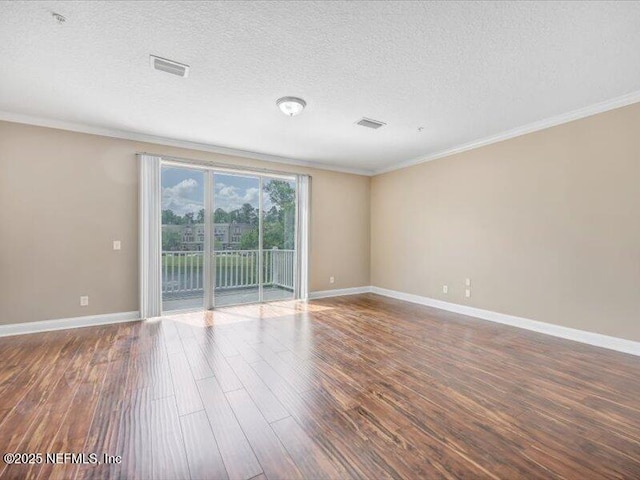 4442 Capital Dome Dr, Jacksonville, FL 32246 - spare room featuring baseboards, wood finished floors, and crown molding