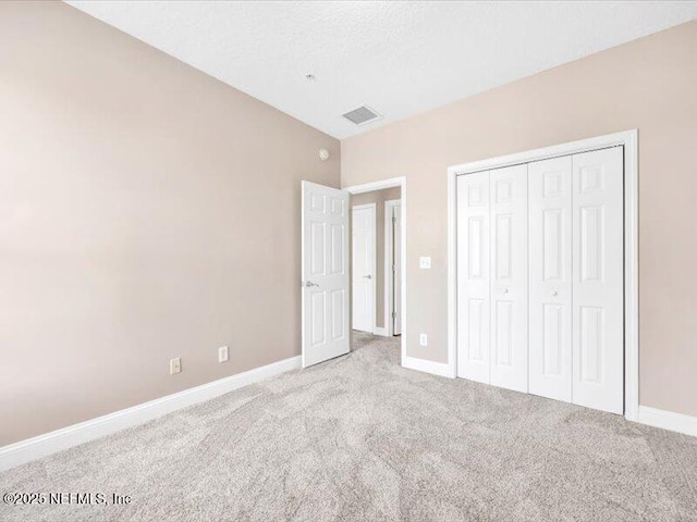 4442 Capital Dome Dr, Jacksonville, FL 32246 - unfurnished bedroom featuring carpet flooring, a closet, baseboards, and visible vents