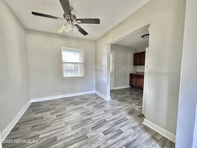 11920 Betula Rd, Jacksonville, FL 32246 - empty room with wood finished floors, baseboards, and ceiling fan