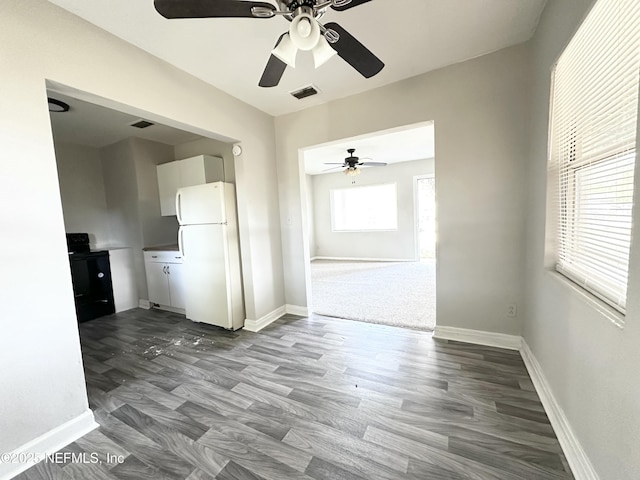 11920 Betula Rd, Jacksonville, FL 32246 - spare room featuring ceiling fan, baseboards, dark wood-style floors, and visible vents