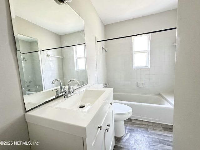 11920 Betula Rd, Jacksonville, FL 32246 - bathroom featuring wood finished floors, toilet, vanity, and shower / bathtub combination