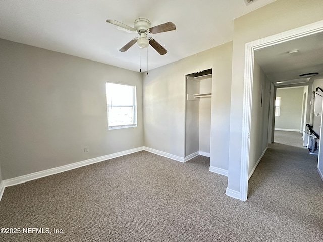11920 Betula Rd, Jacksonville, FL 32246 - unfurnished bedroom featuring dark carpet, a closet, baseboards, and ceiling fan