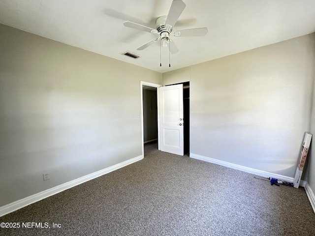 11920 Betula Rd, Jacksonville, FL 32246 - unfurnished room featuring dark carpet, visible vents, and baseboards