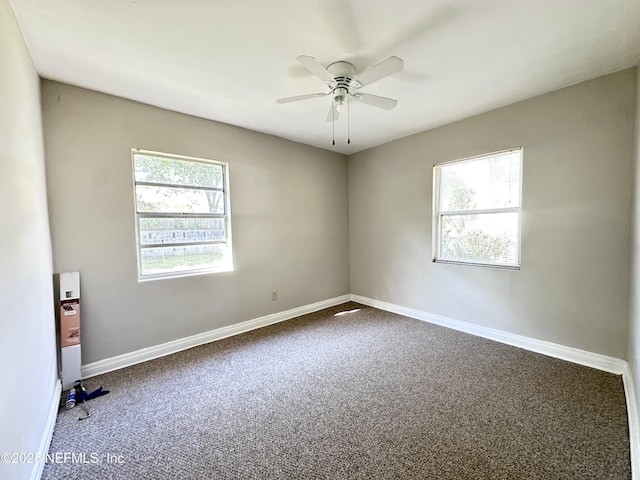 11920 Betula Rd, Jacksonville, FL 32246 - carpeted empty room featuring baseboards and a ceiling fan